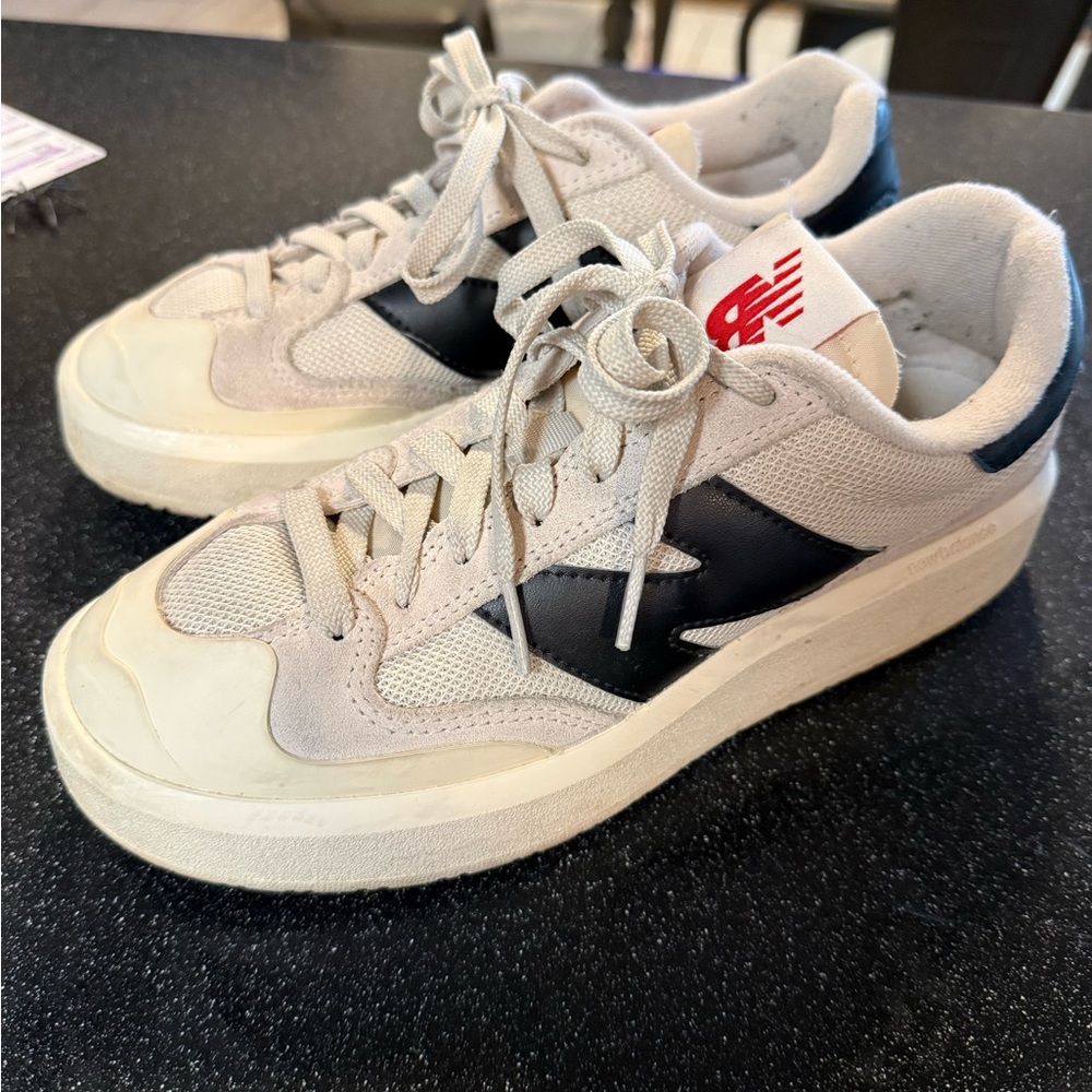 New Balance Beige and Black Low-Top Sneakers